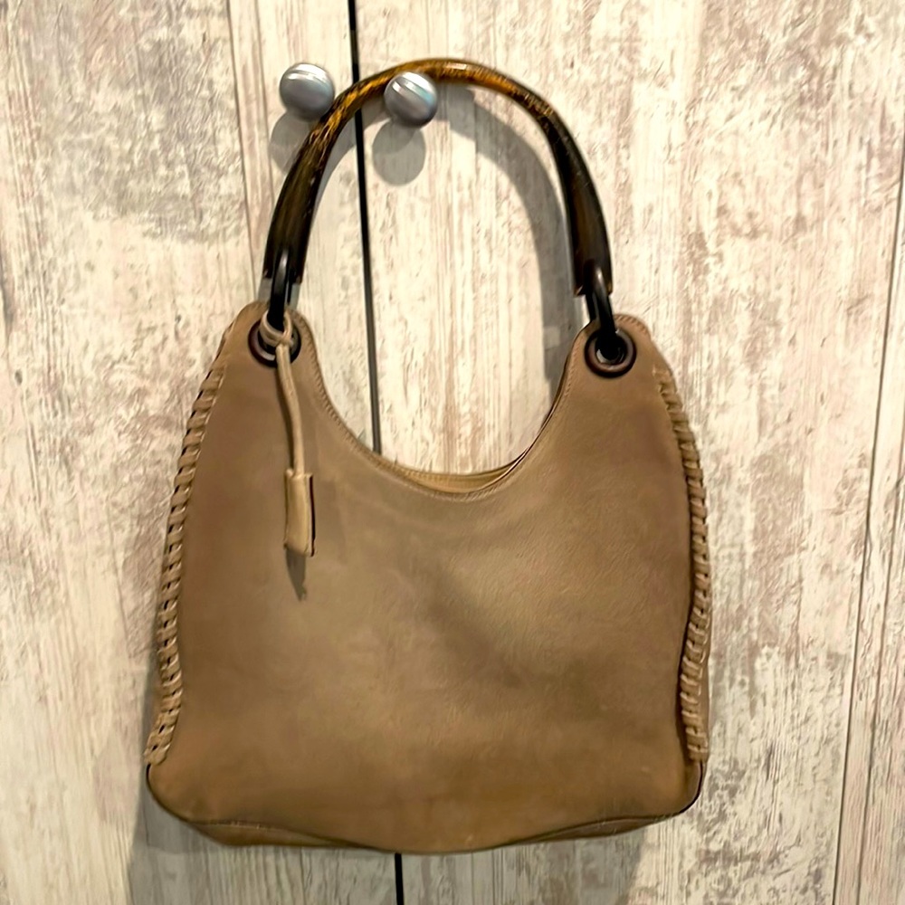 Gently used suede Gucci bag with classic wood handle. 12” x 7.5”